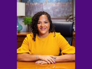 Renee Branch Canady sitting at a desk.