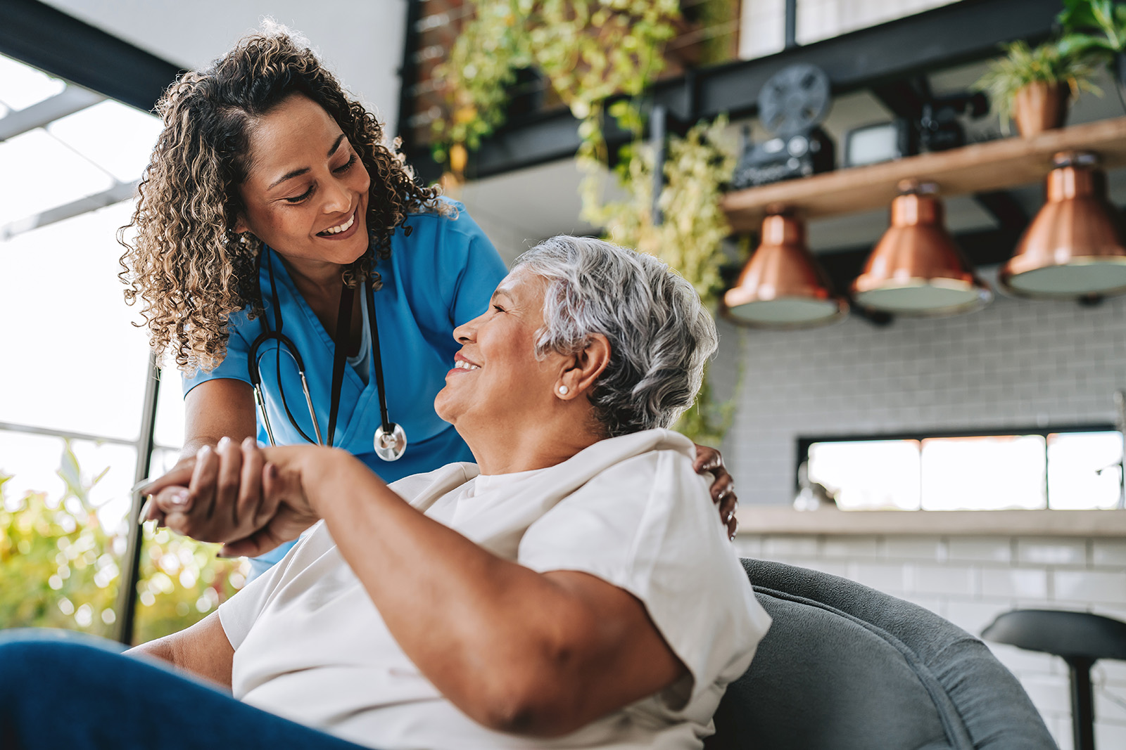 Medical staff assisting elderly person