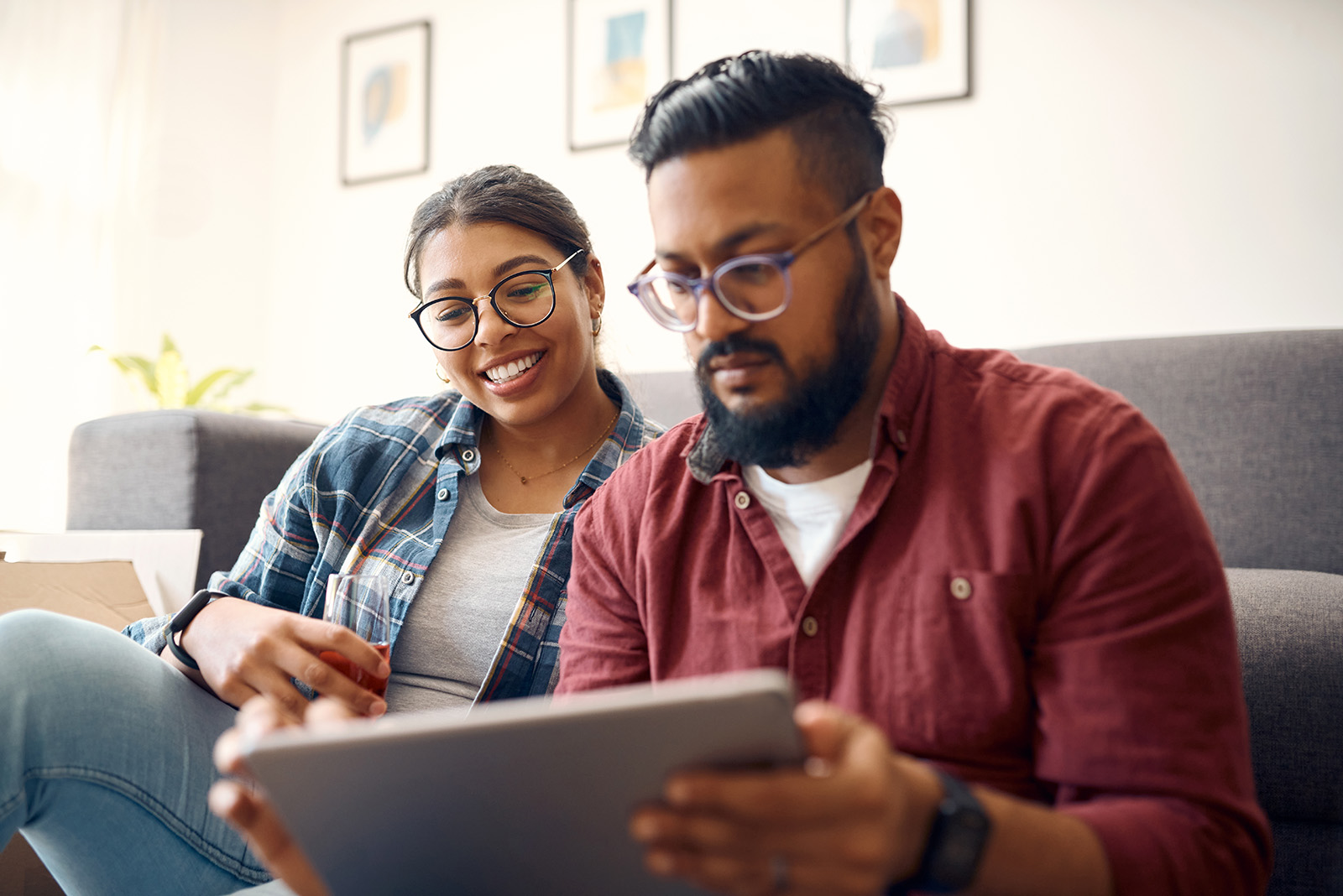 Two individuals reviewing information together on digital device